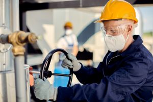 albino-worker-with-face-mask-tightening-valve-construction-site(1)